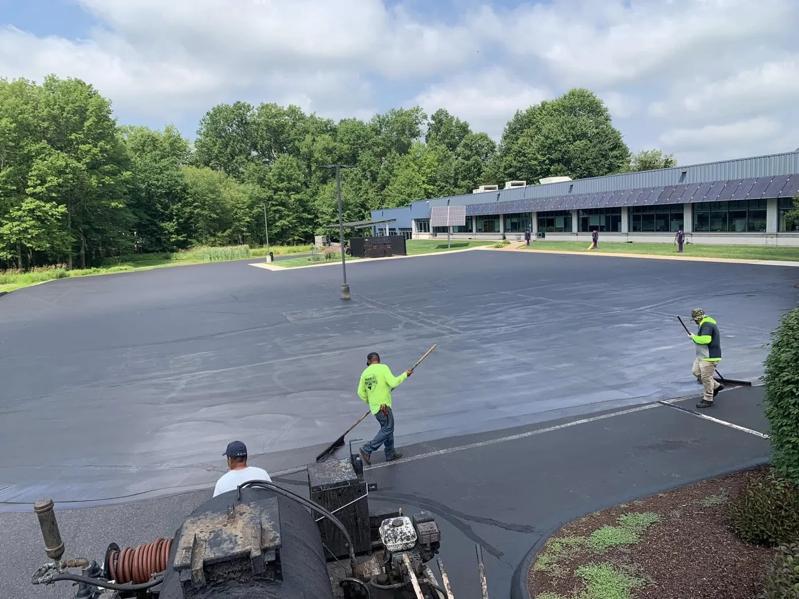 Pavement Protectors crew sealcoating a large commercial lot in Connecticut