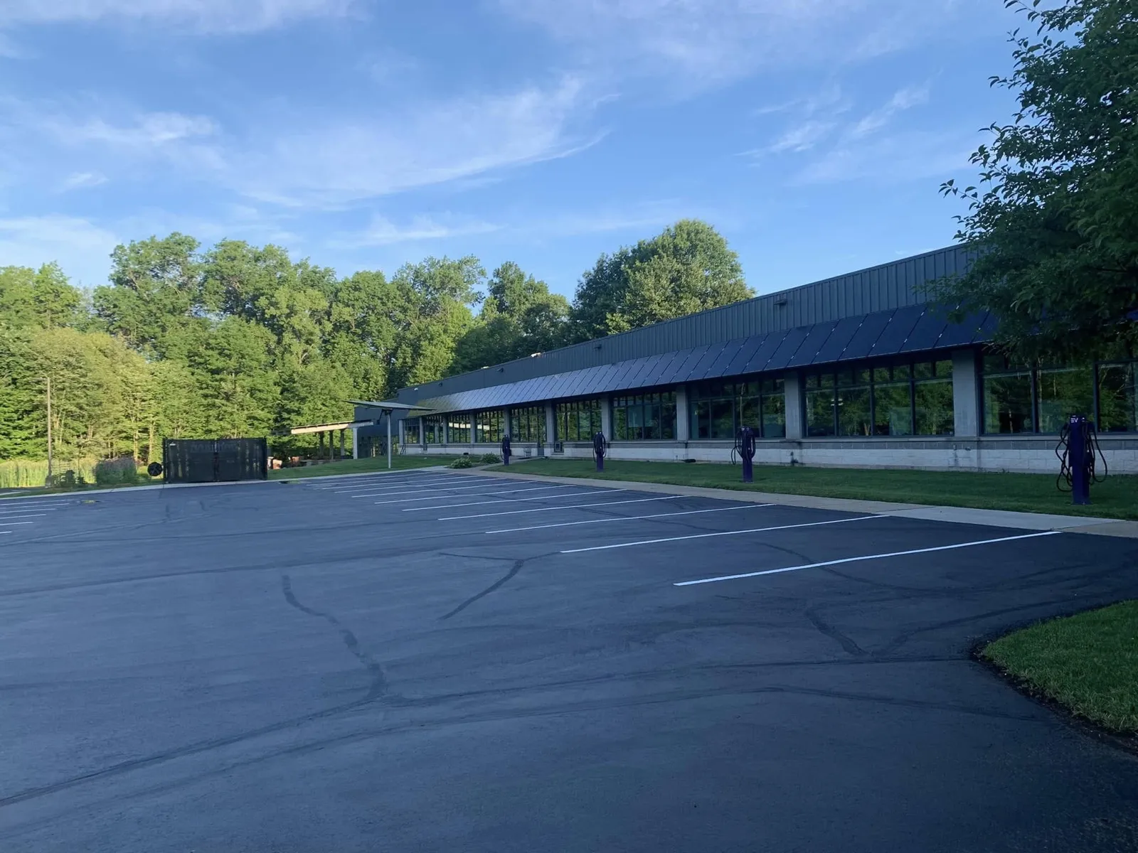 Striped commercial parking lot with EV charging stations in Connecticut