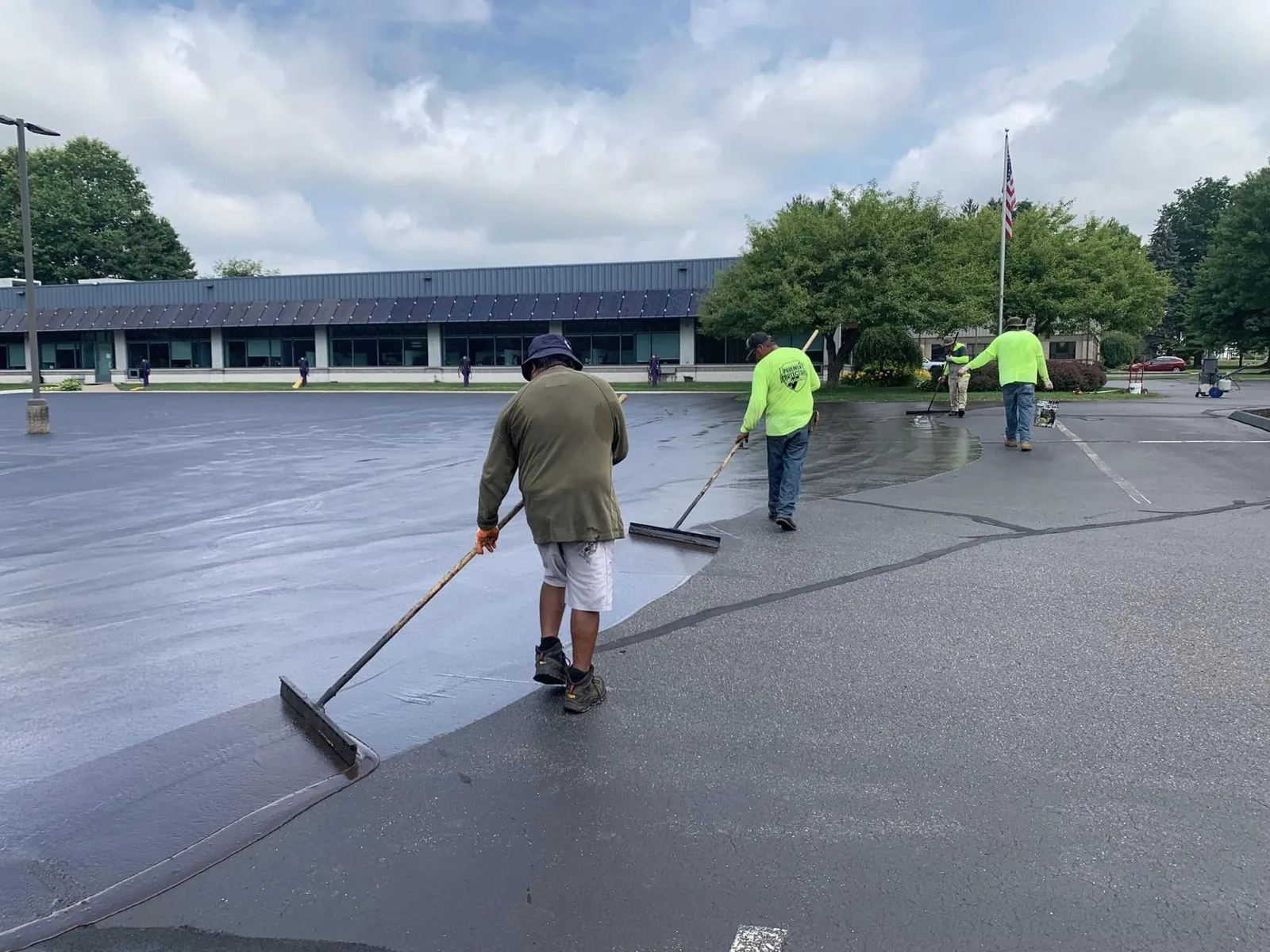 Pavement Protectors crew sealcoating a commercial parking lot in Connecticut