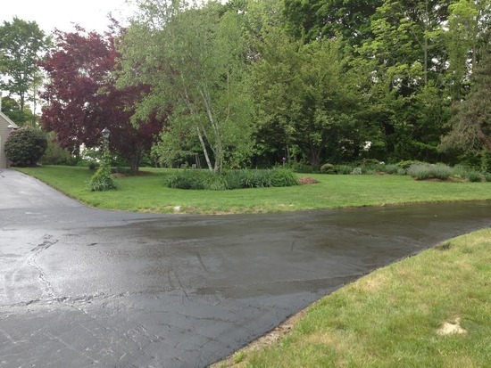 Freshly sealcoated curved residential driveway in Branford, CT