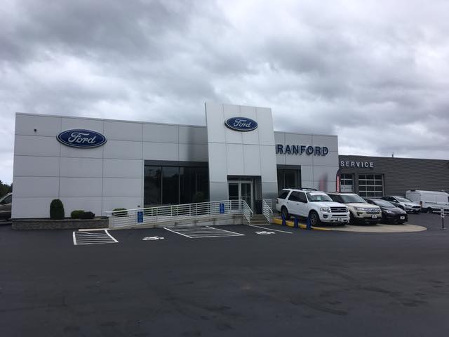 Sealcoated and striped Ford of Branford dealership parking lot in Connecticut
