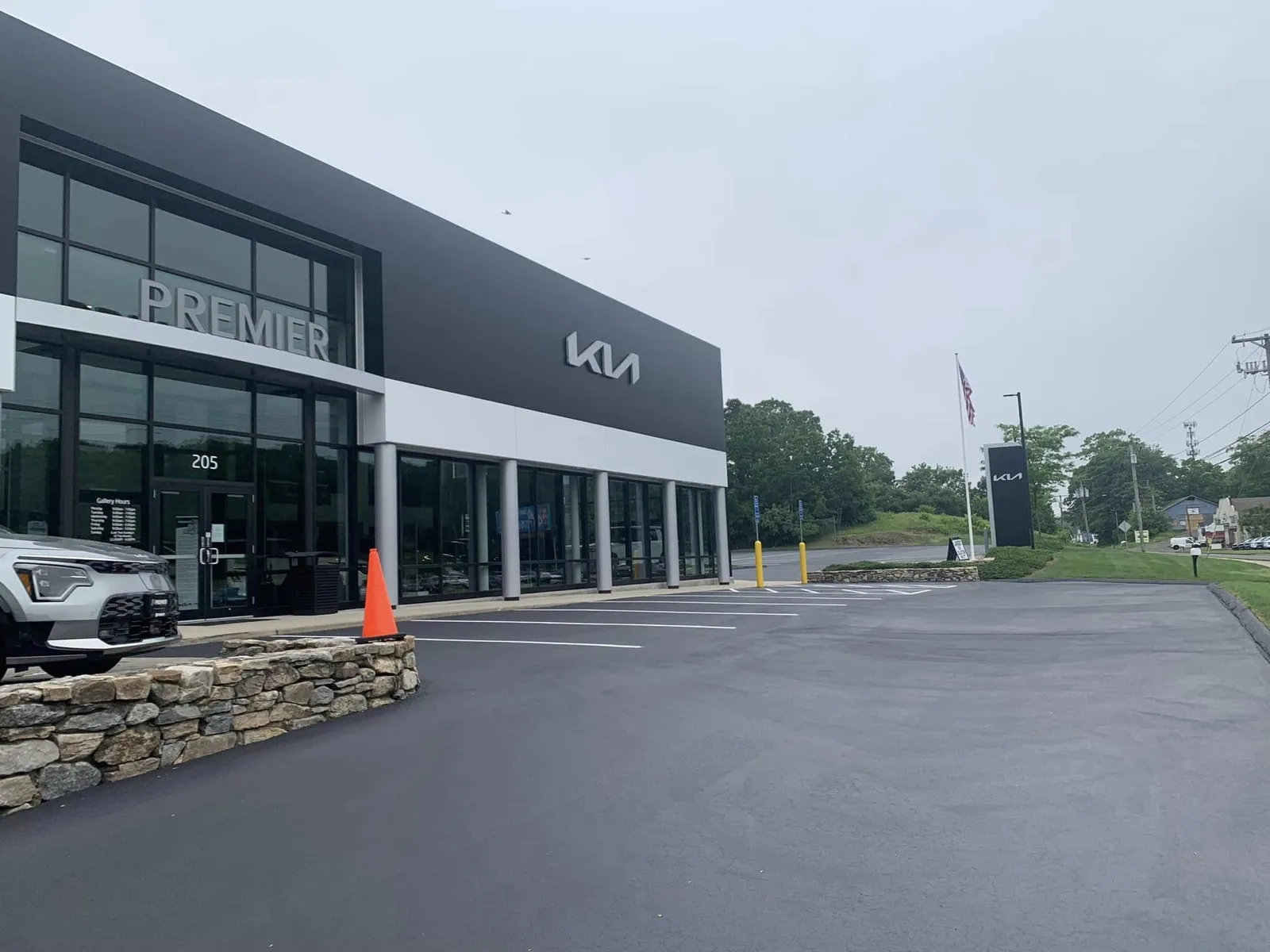 Freshly sealcoated and striped Premier Kia dealership lot in Connecticut