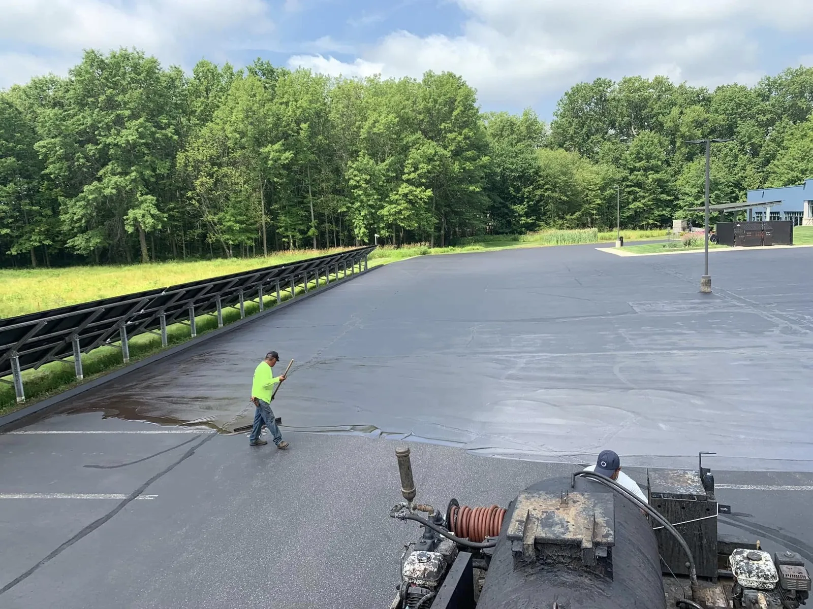 Large commercial lot sealcoating with spray application in Connecticut