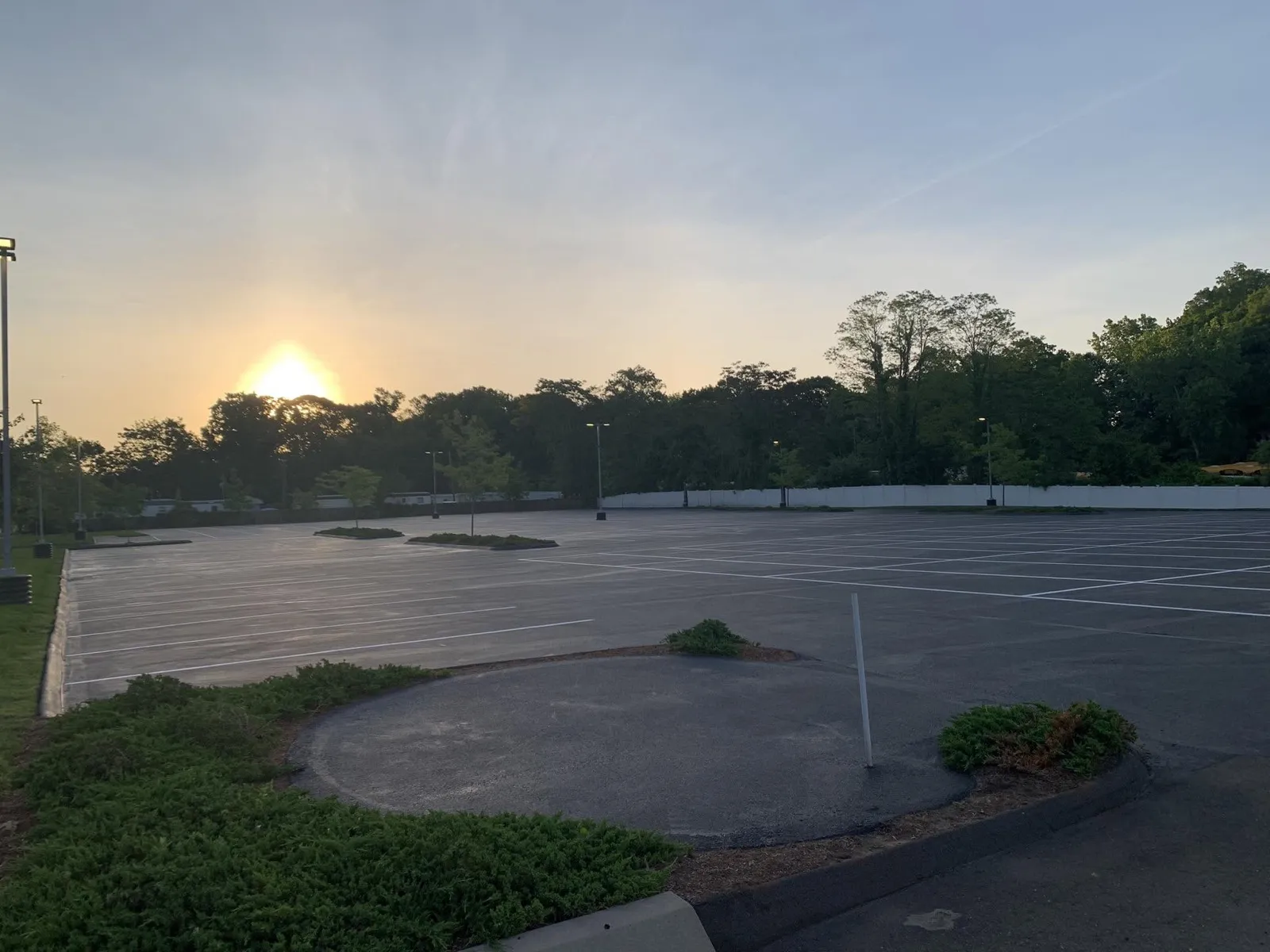 Large freshly striped commercial parking lot at sunset in Connecticut