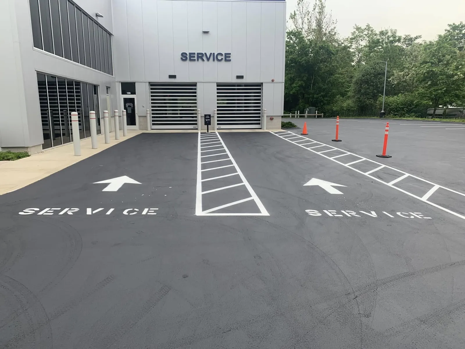 Service lane striping and stenciling at a Subaru dealership in Connecticut